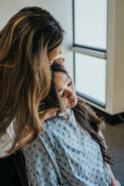 Chiropractor Rancho Cucamonga CA Emily Ronduen Bautista Dr. Emily Ronduen Bautista adjusting a female patient's neck to provide realignment and relief
